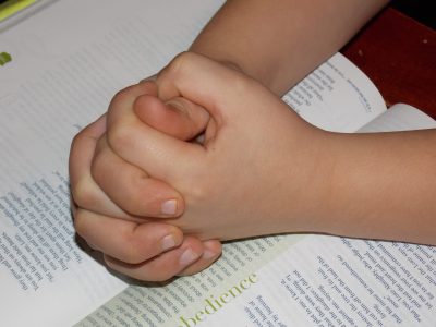 Child Hands With Bible